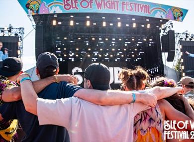 Crowds of people watching an act on the main stage at the Isle of Wight Festival, music, what's on, event