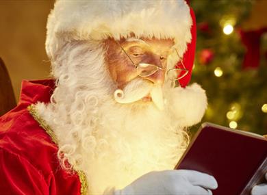Santa reading a book