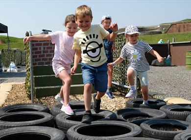 Children enjoying the assault course at Fort Nelson