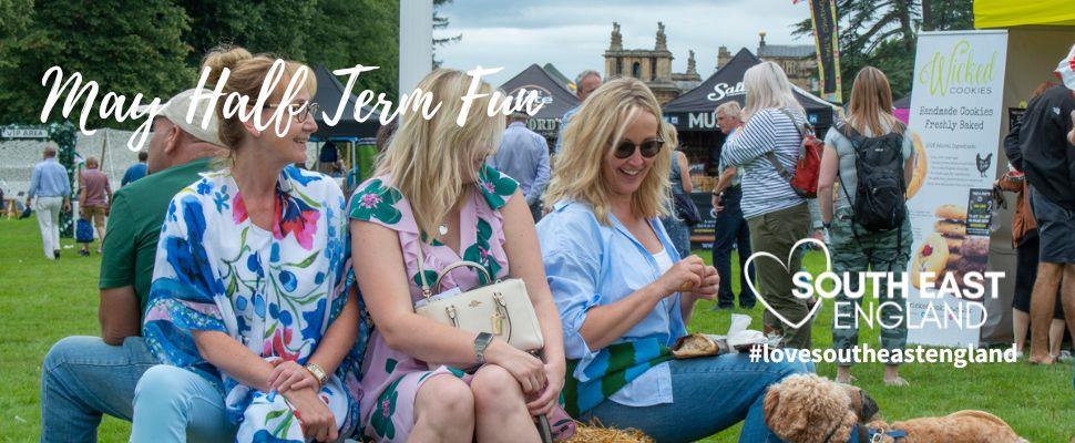 Ladies with their dogs enjoying a day at the Blenheim Palace Food Festival.