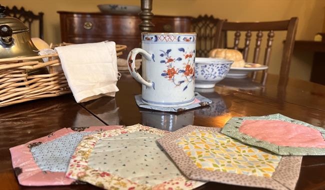 Sew your own hexi coasters and then hand-quilt them as much or as little as you want. It's simple sewing so as long as you can thread a needle you can