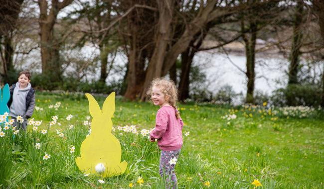 Children on the grass enjoying an Easter trail