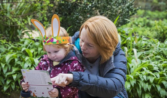 Parent and Child enjoying National Trust Hinton Ampner Easter Adventures trail