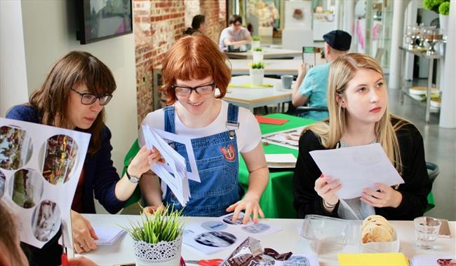 Three people taking part in a craft activity at Aspex Portsmouth