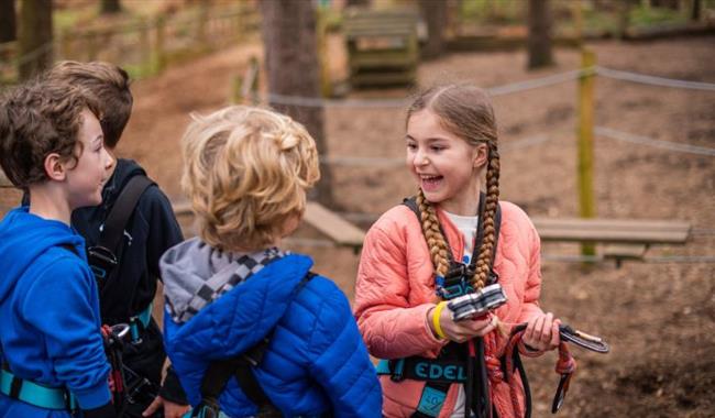 Children having fun at Black Park Go Ape in Wexham right on the border of Slough, Berkshire