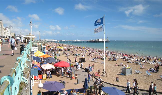 Colourful beach huts on the promenade at Hove Gardens, East Sussex