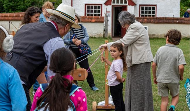 rope making demonstration with children having a go