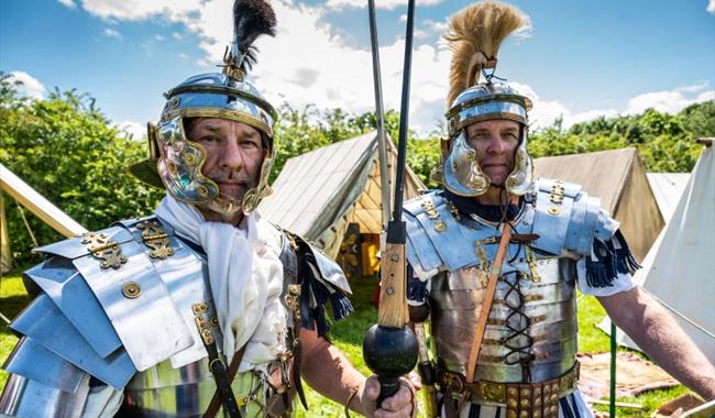 two men in roman gladiator armour