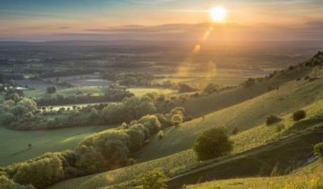 View from Ditchling Beacon Near Brighton and Hove in East Sussex at sunset.