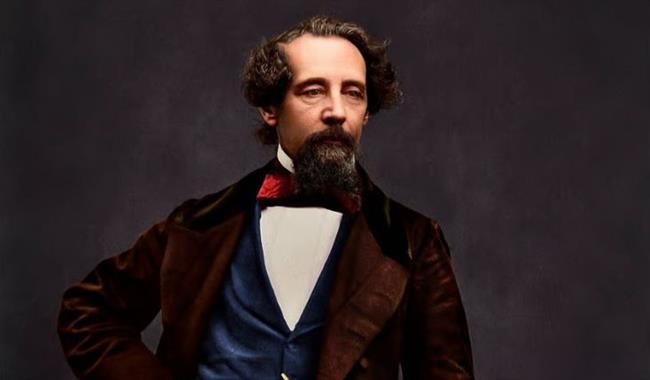 Charles Dickens standing by a desk, Dickens House Party Weekend at The Royal Hotel, Ventnor, Isle of Wight, event, what's on