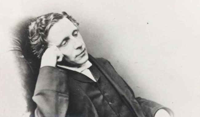 a man sitting in a chair in deep thought