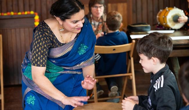 Lady in a saree talking to child