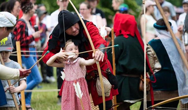 Families enjoying the Medieval Festival at Chiltern Open Air Museum