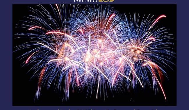 Stock photograph of fireworks going off against a black night sky