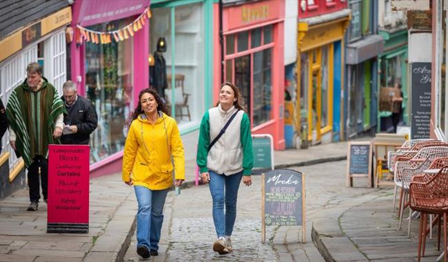 Friends exploring Folkestone High Street in Kent