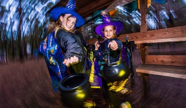 Two children trying out the new Halloween Potion trail at Go Ape Bedgebury