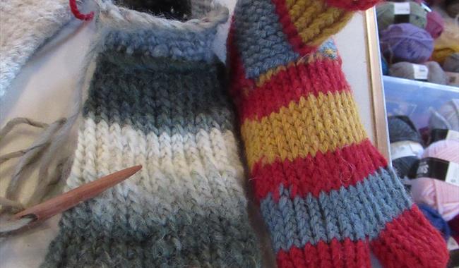 Two woollen socks made with the nailbinding method.