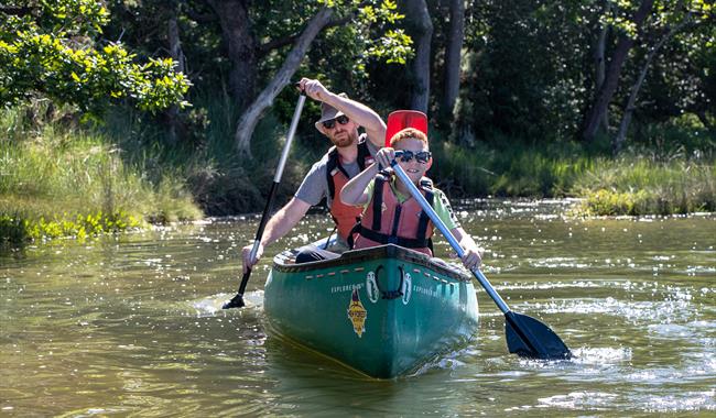 A Father and son in a canoe