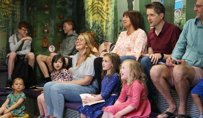 Children laughing and enjoying a storytelling session