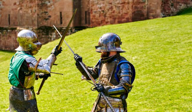 Two armoured knights fighting at Knights' Tournament at Carisbrooke Castle, history event, what's on, Isle of Wight