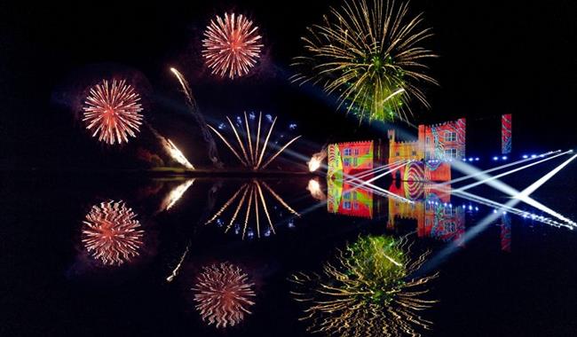 A colourful fireworks display over Leeds Castle and its moat