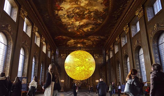 A large, realistic rendering of the Sun is suspended in the centre of the Painted Hall. The model depicts sunspots, spicules, and filaments.