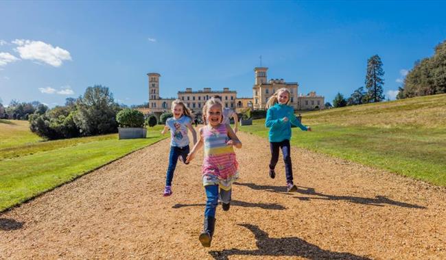 Children running along the path in front of Osborne House, May Half Term fun, events, what's on, Isle of Wight