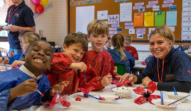 Children at Cranbrook Primary School making poppies