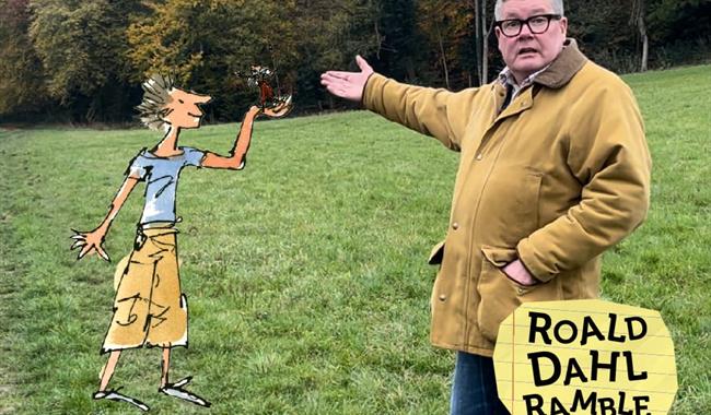 A man gestures towards a Quentin Blake illustration of Billy and the Minpins