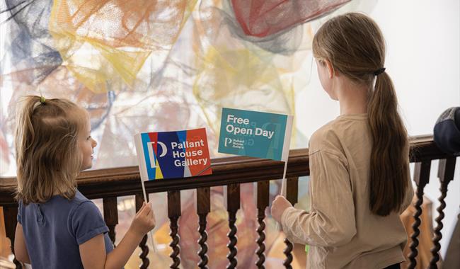 Children waving Pallant House Gallery flags