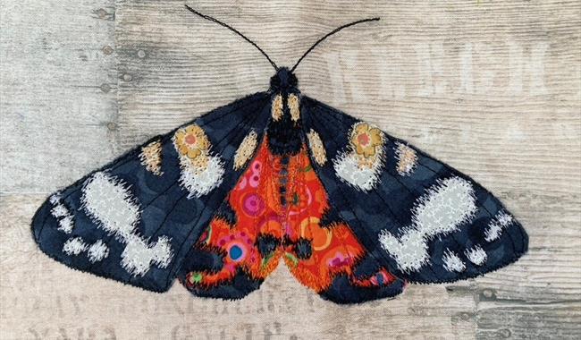 Picture of a butterfly made from textiles as part of exhibition at Sir Harold Hillier Gardens