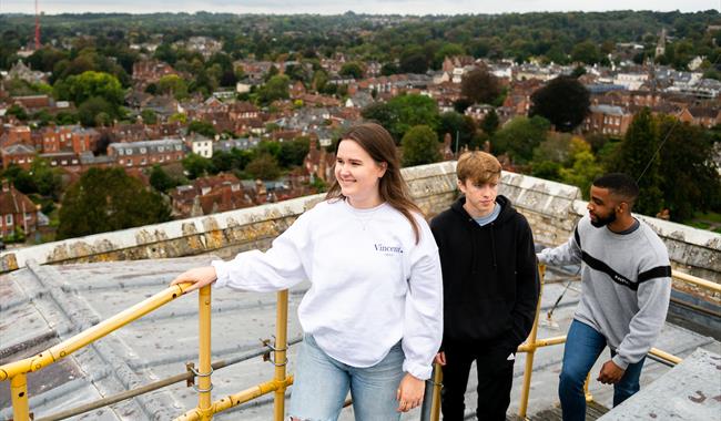 Group of friends doing Winchester Cathedral Tower Tour