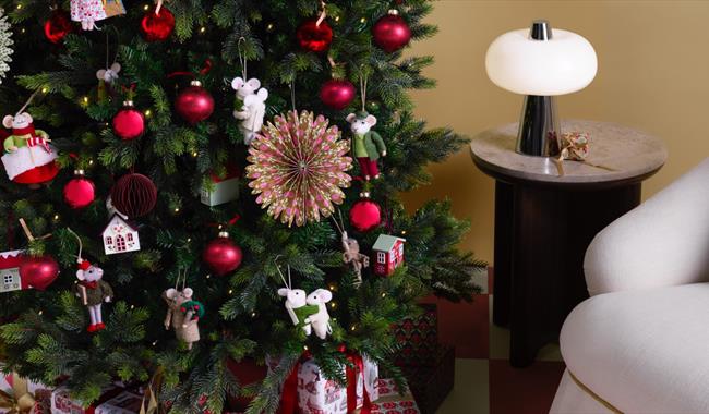 Christmas Tree decorated with Red Baubles and other festive decorations