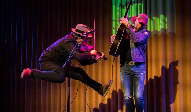 Image: Brooks Williams and Aaron Catlow performing on stage
