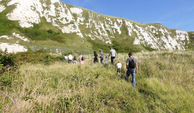 Group walking across Samphire Hoe in Kent