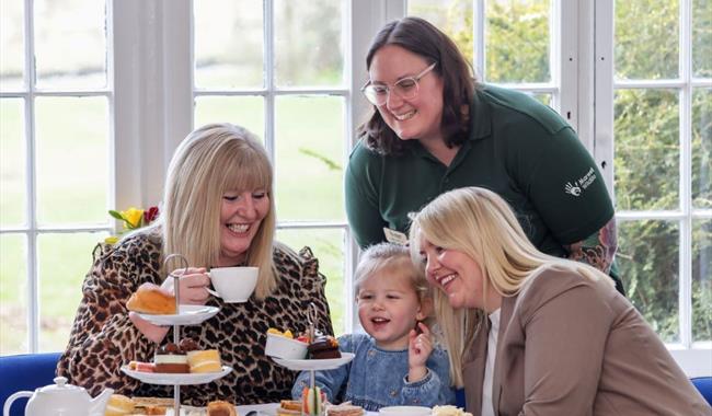Family eating afternoon tea at Marwell Zoo