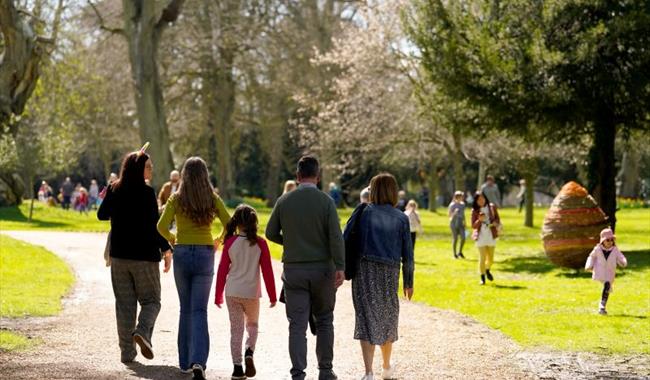 A family walking in Blenheim Palace during Easter activities