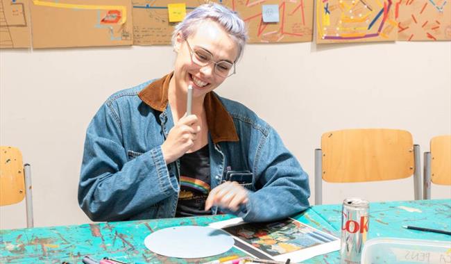 An image of a participant in the Drink and Draw workshop.