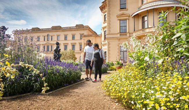 Couple walking around the garden outside Osborne House, garden tour, event, what's on, Isle of Wight