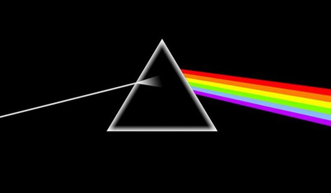 Pink floyd album cover artwork. There is a white triangle and a rainbow coming from the right hand side of the triangle.