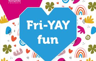 A white background that has lots of different coloured shapes and rainbows. In front you can see a blue heart with the words Fri-YAY.