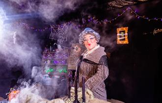 Effel stood behind her cauldron