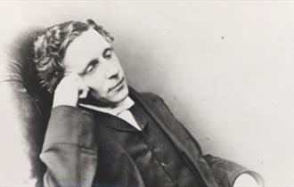 a man sitting in a chair in deep thought