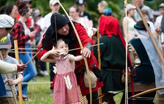 Families enjoying the Medieval Festival at Chiltern Open Air Museum