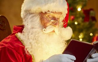 Santa reading a book