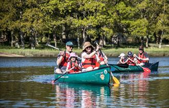 A family enjoying paddling along the Beaulieu River for Fathers Day