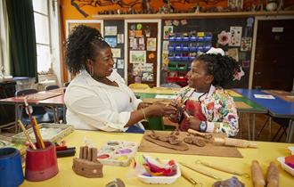 Picture of a child and an adult doing arts and crafts together