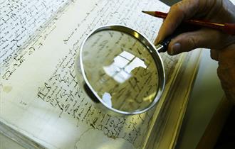 a magnify glass looking at a document