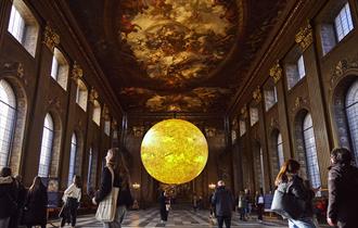 A large, realistic rendering of the Sun is suspended in the centre of the Painted Hall. The model depicts sunspots, spicules, and filaments.