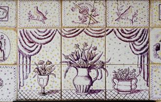 Detail Photo of Dora Carrington's Decorative Clay Tile Fireplace